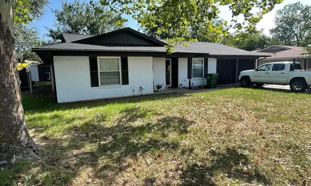 Professional roofing crew working on a residential roof in Chino
